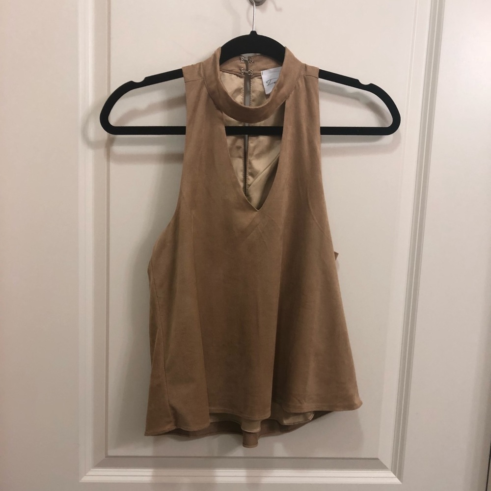 Camel brown high neck sleeveless crop-ish top.
